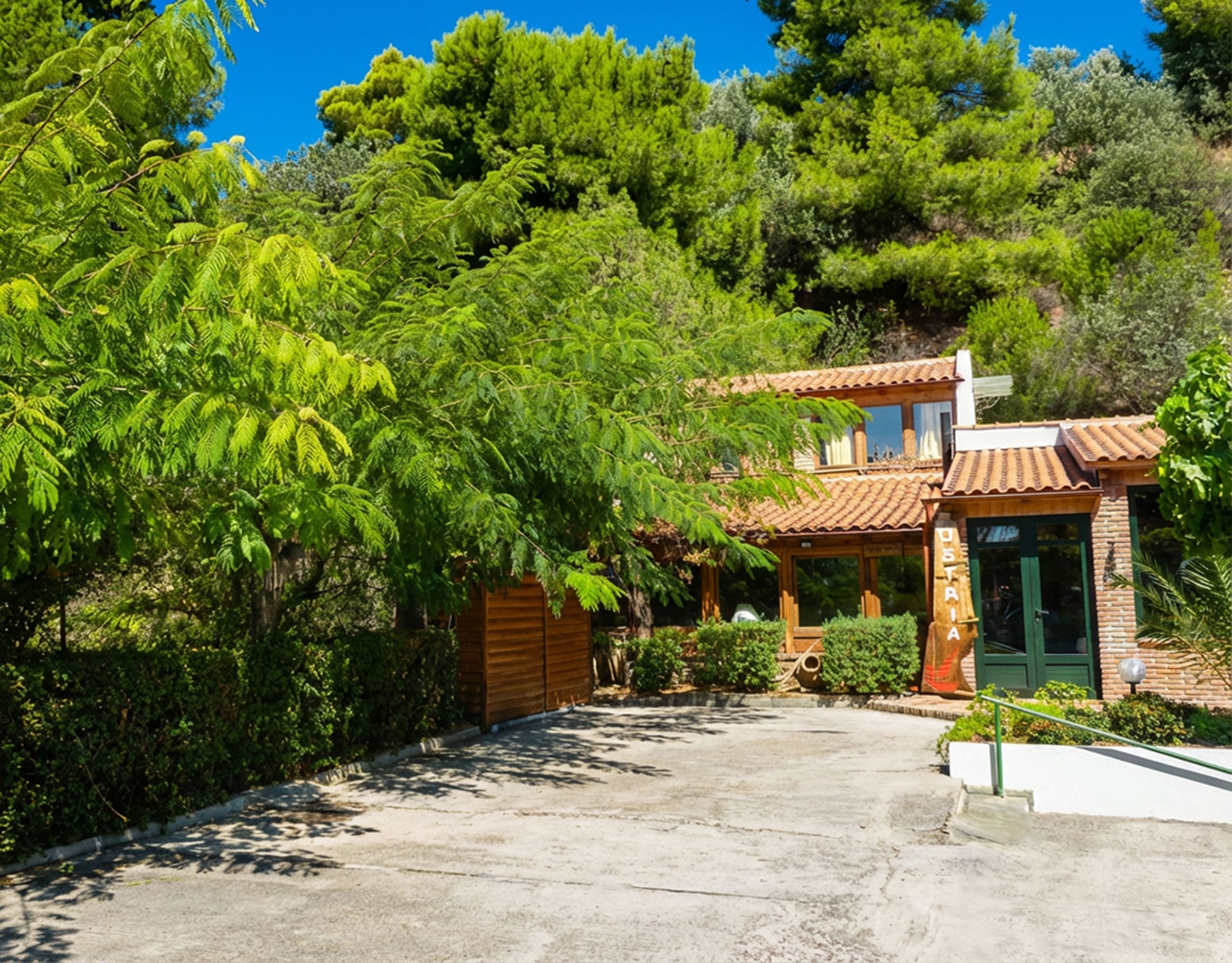 Landscaped garden area at hotel property in Limi, Evia