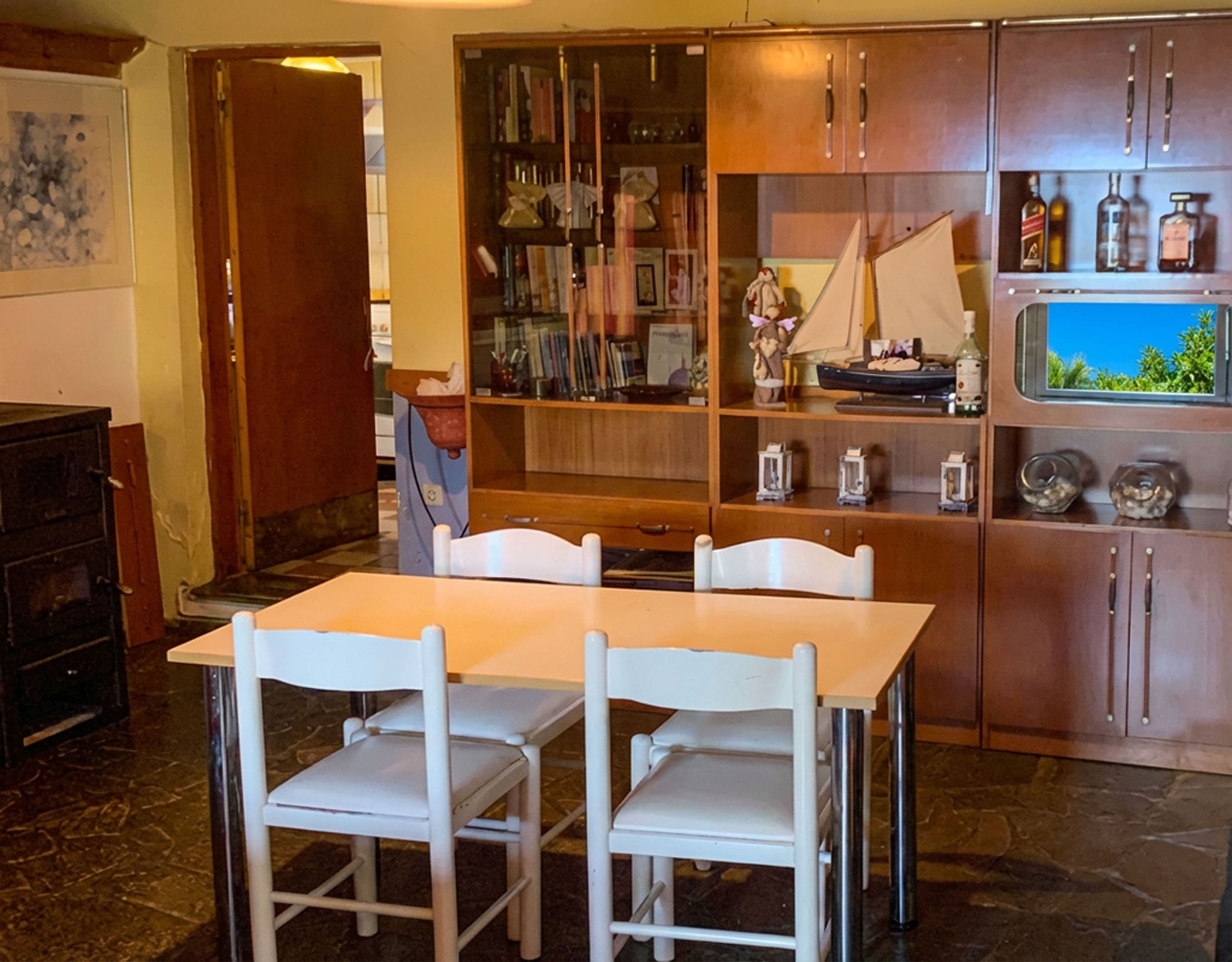 Dining area with table and built-in storage in hotel property in Limi, Evia