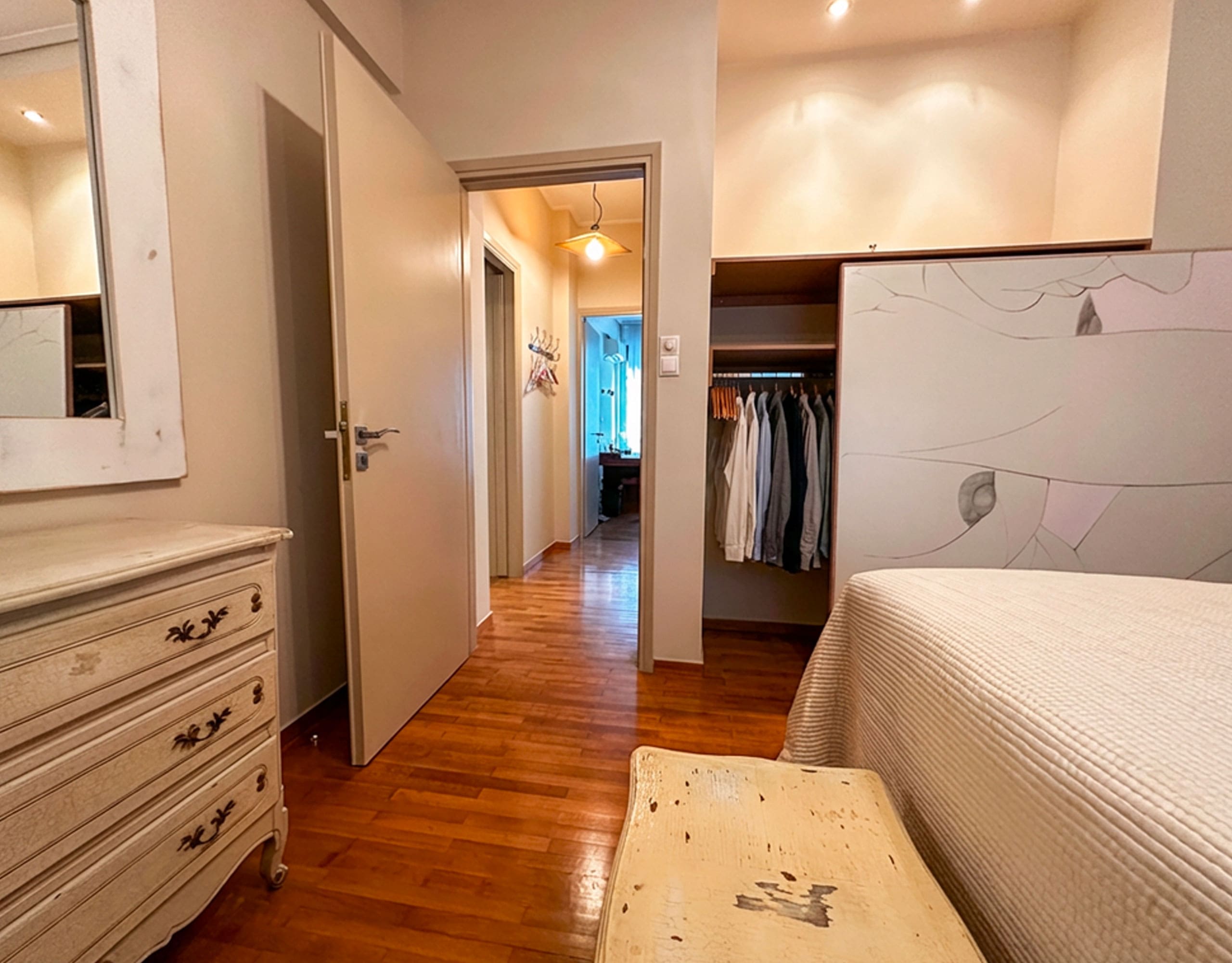 Bedroom with hallway view and built-in wardrobe in Ampelokipoi renovated apartment