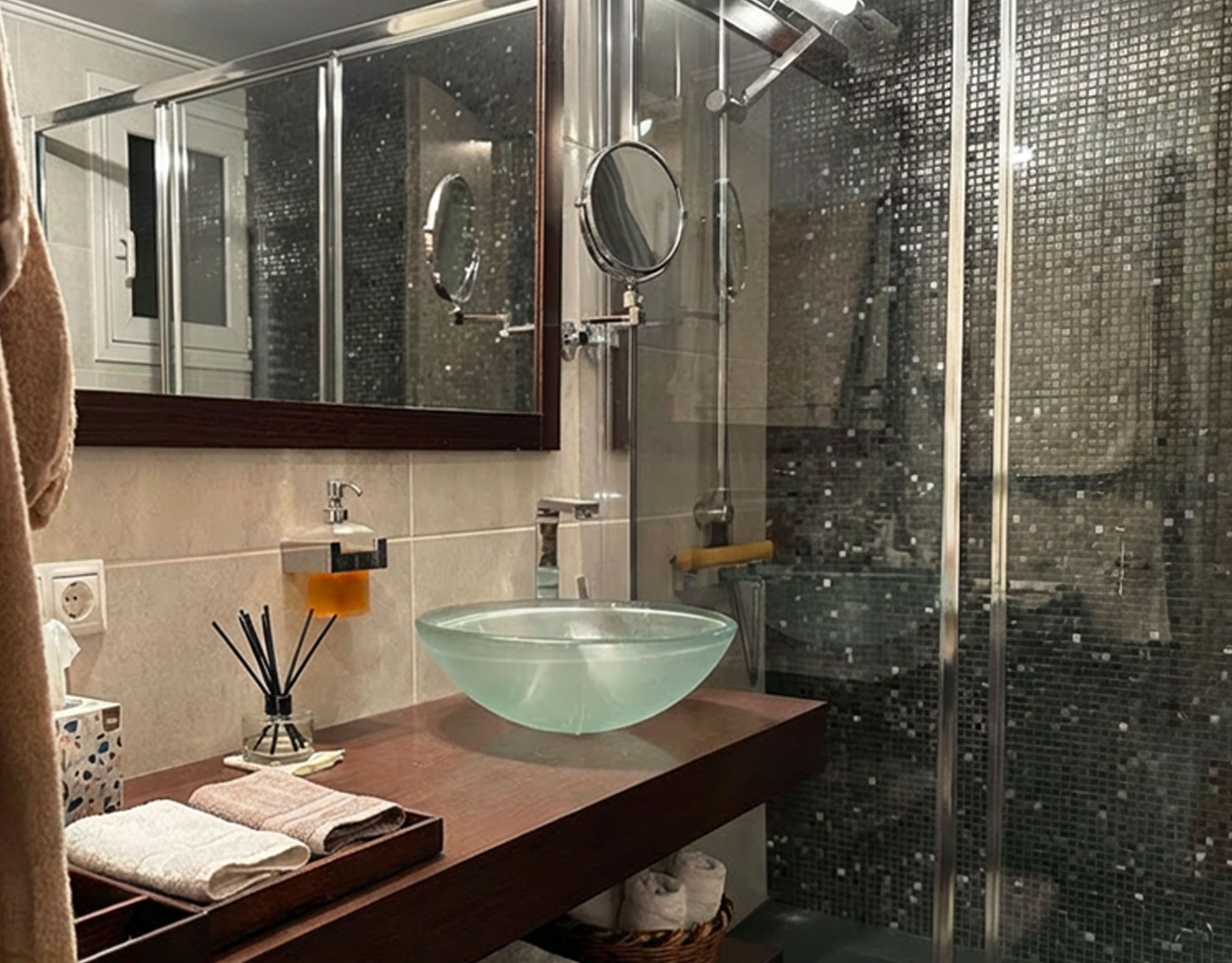 Bathroom with glass shower enclosure and modern vanity sink in Ampelokipoi renovated apartment