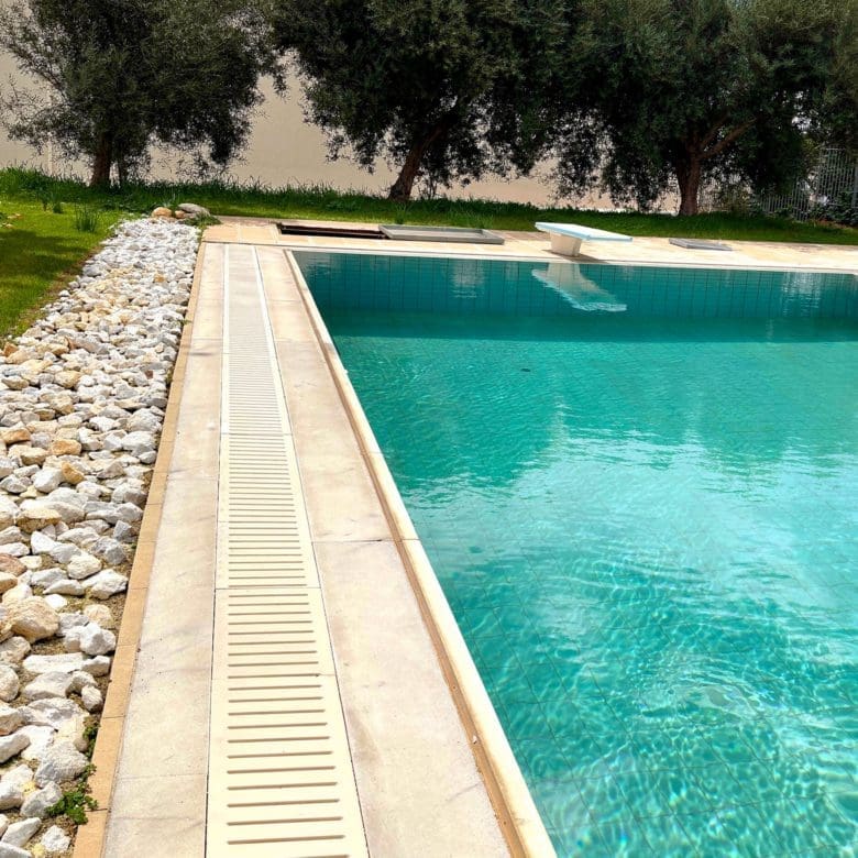 Pool edge and water detail at the private swimming pool in Eretria