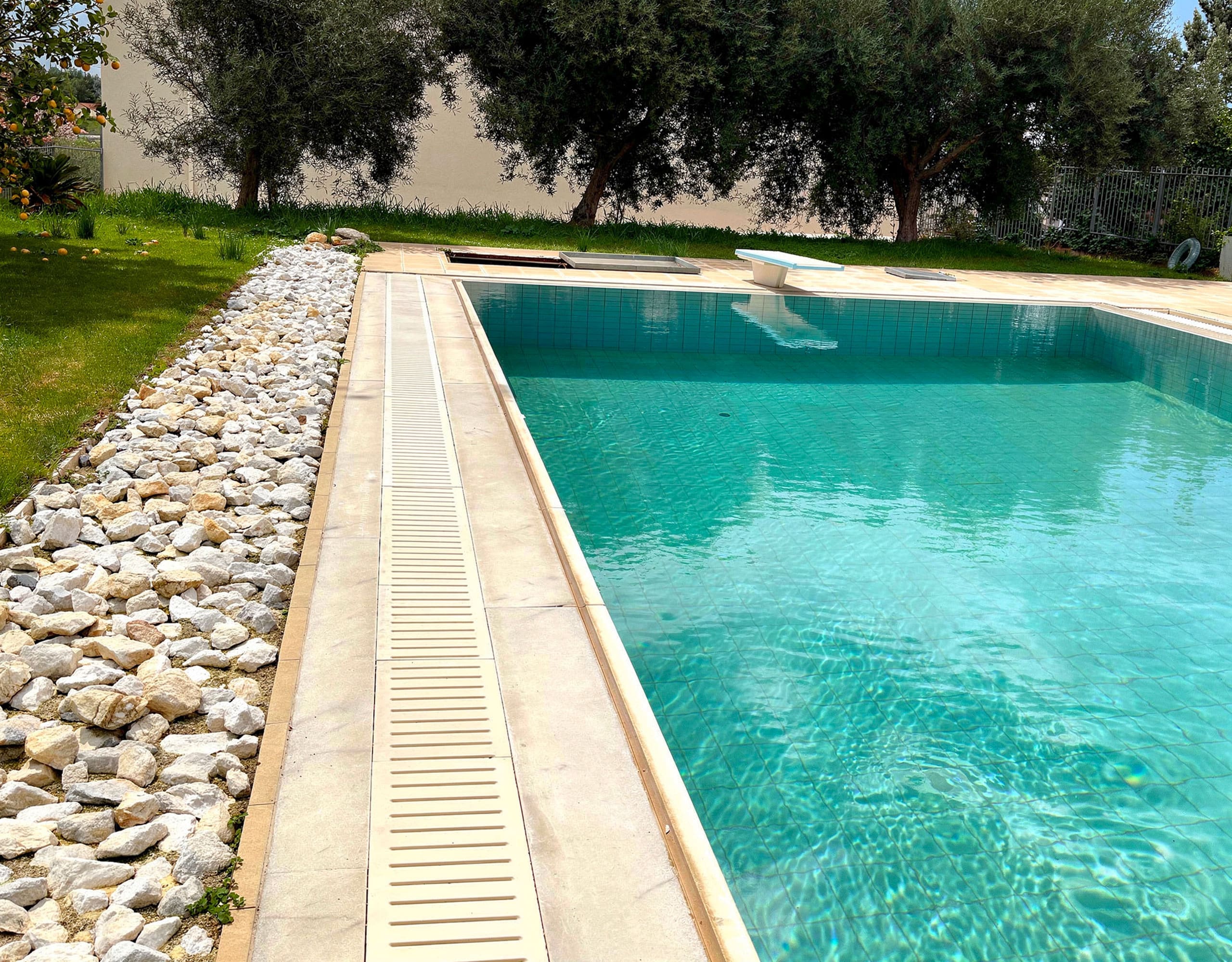 Pool edge and water detail at the private swimming pool in Eretria