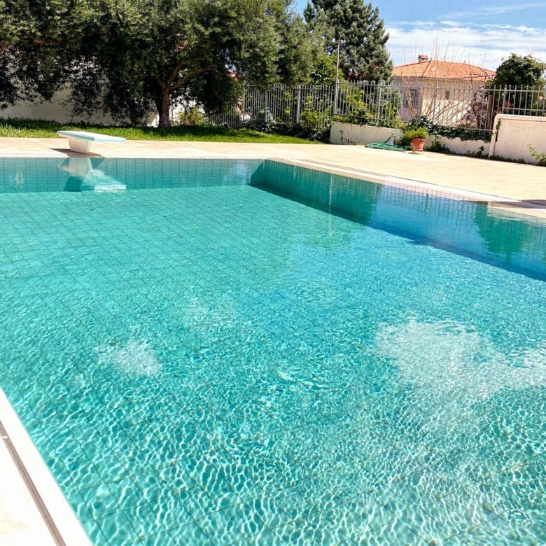 Long view of the private pool and garden area at the Eretria maisonette
