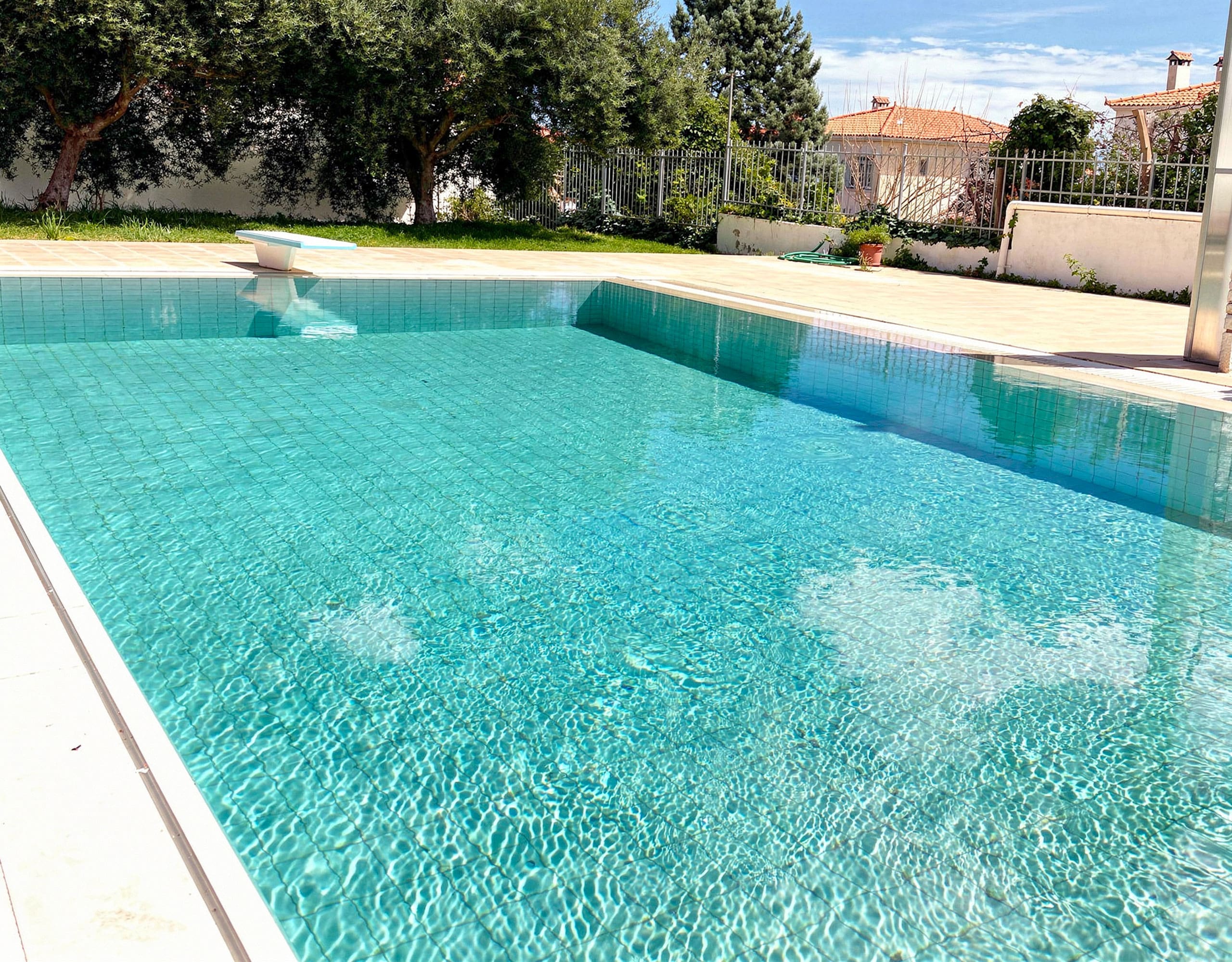 Long view of the private pool and garden area at the Eretria maisonette