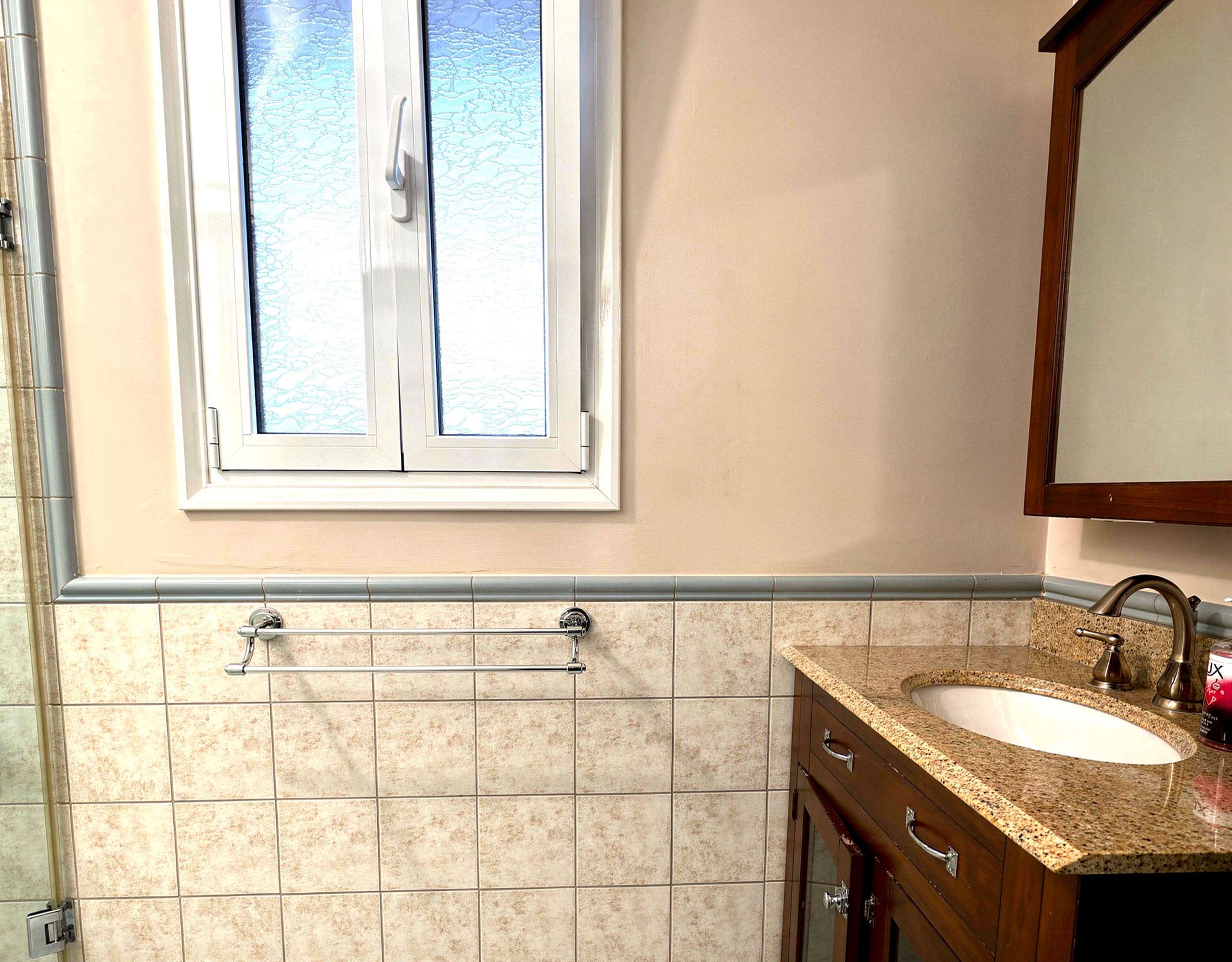 Bathroom window and tiled wall detail in the Eretria maisonette