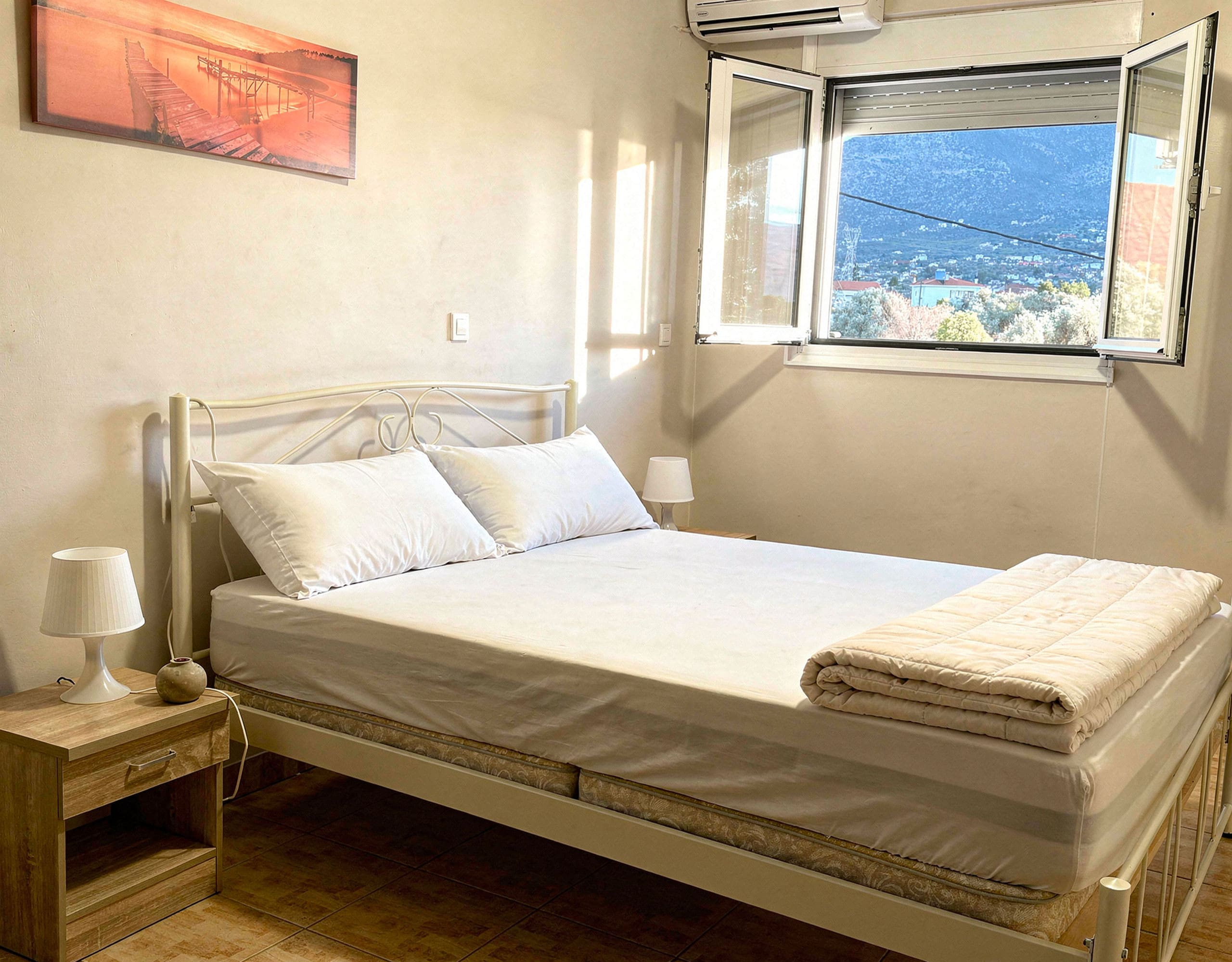 Bedroom with window sea view in the Eretria maisonette, Evia