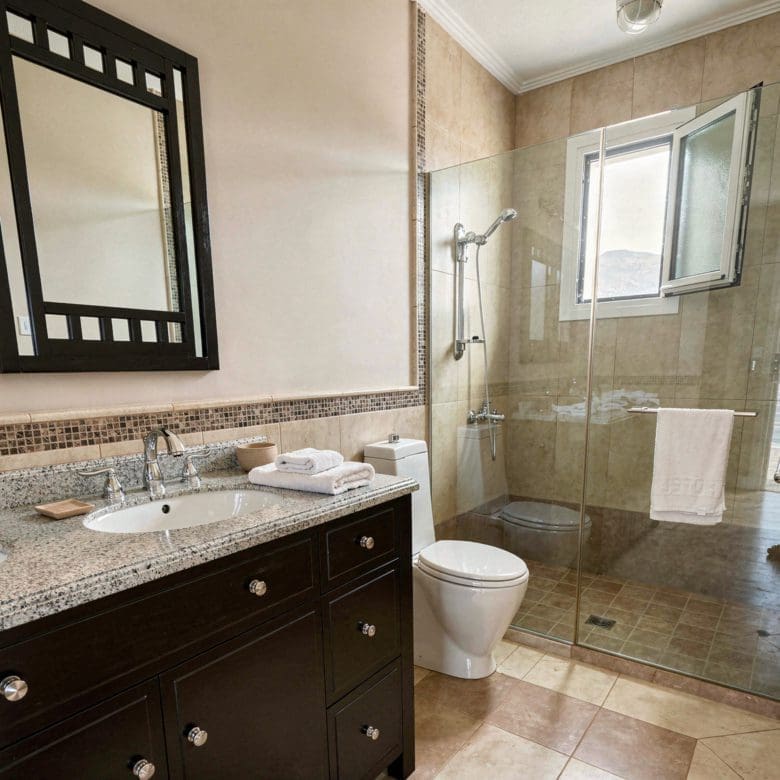Bathroom vanity and sink with mirror in the Eretria maisonette