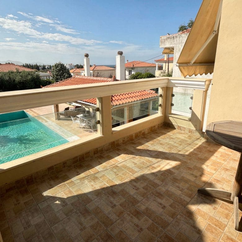 Poolside terrace for outdoor dining and relaxation at the Eretria maisonette