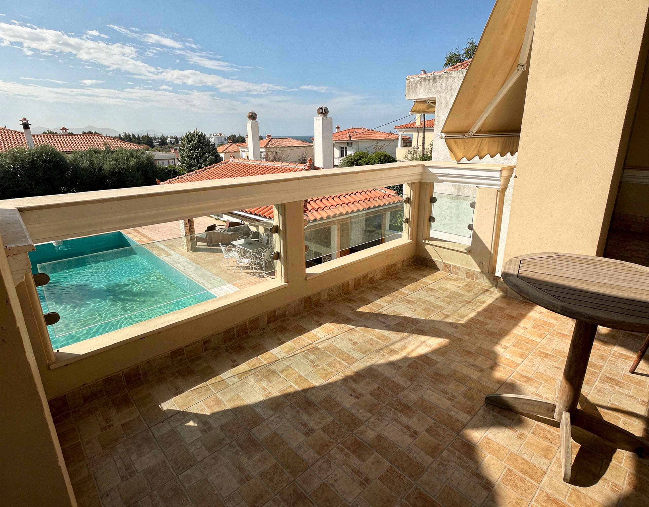 Poolside terrace for outdoor dining and relaxation at the Eretria maisonette