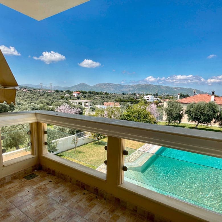 Terrace view over the private pool with sea views in Eretria, Evia