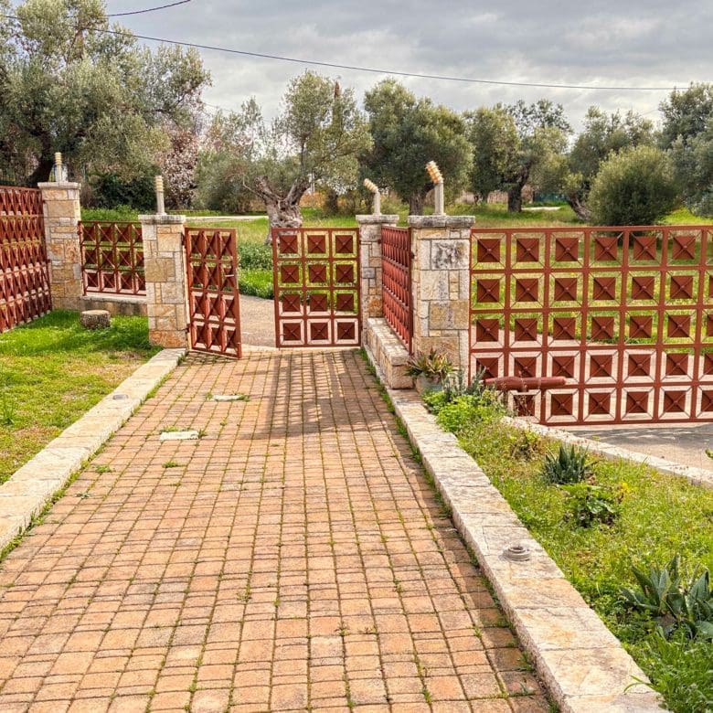 Driveway entrance path leading to the detached maisonette in Eretria, Evia