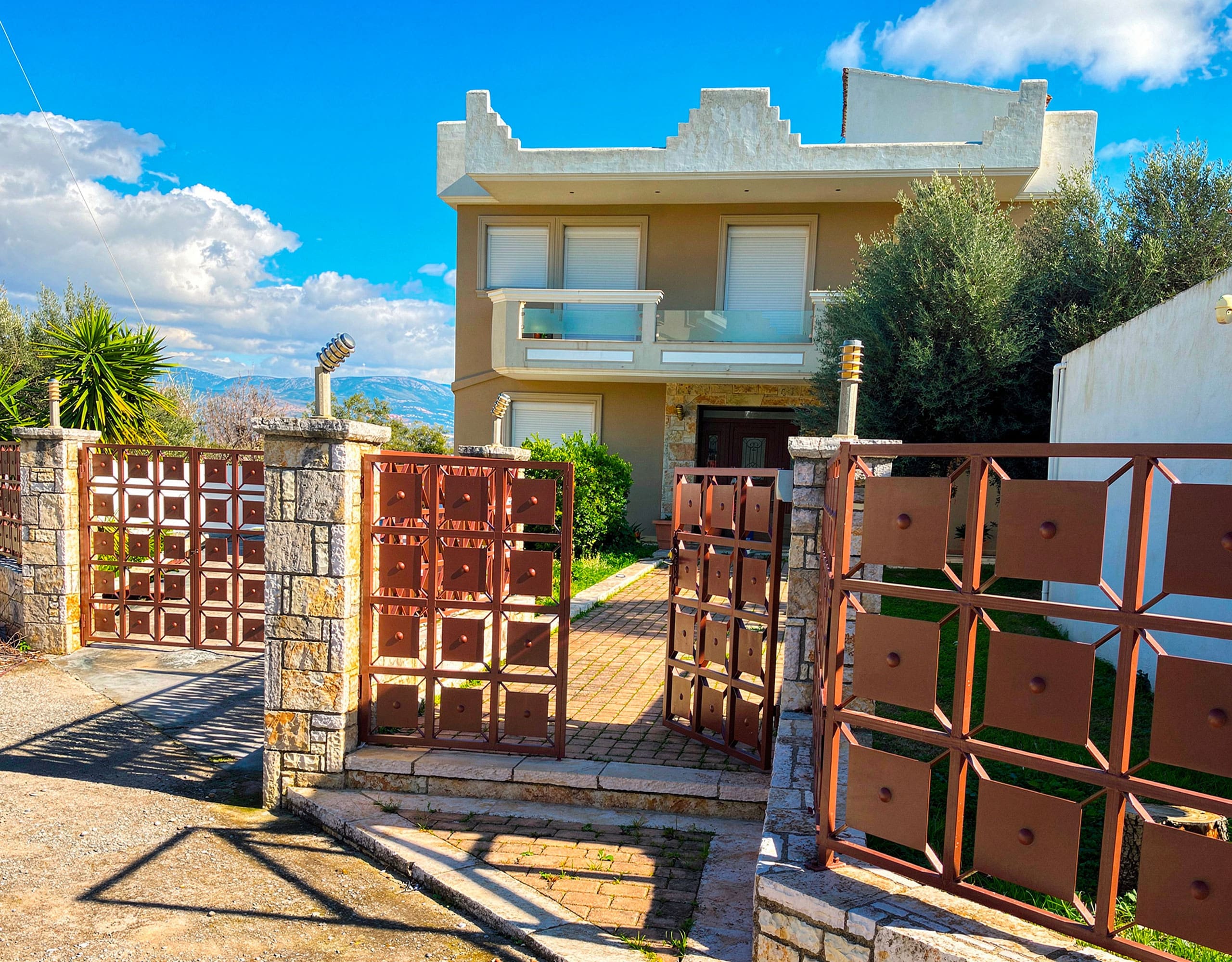 Front entrance and driveway of the detached maisonette in Eretria, Evia