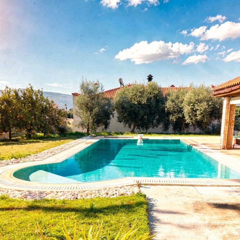 Wide view of the private swimming pool at the detached maisonette in Eretria, Evia