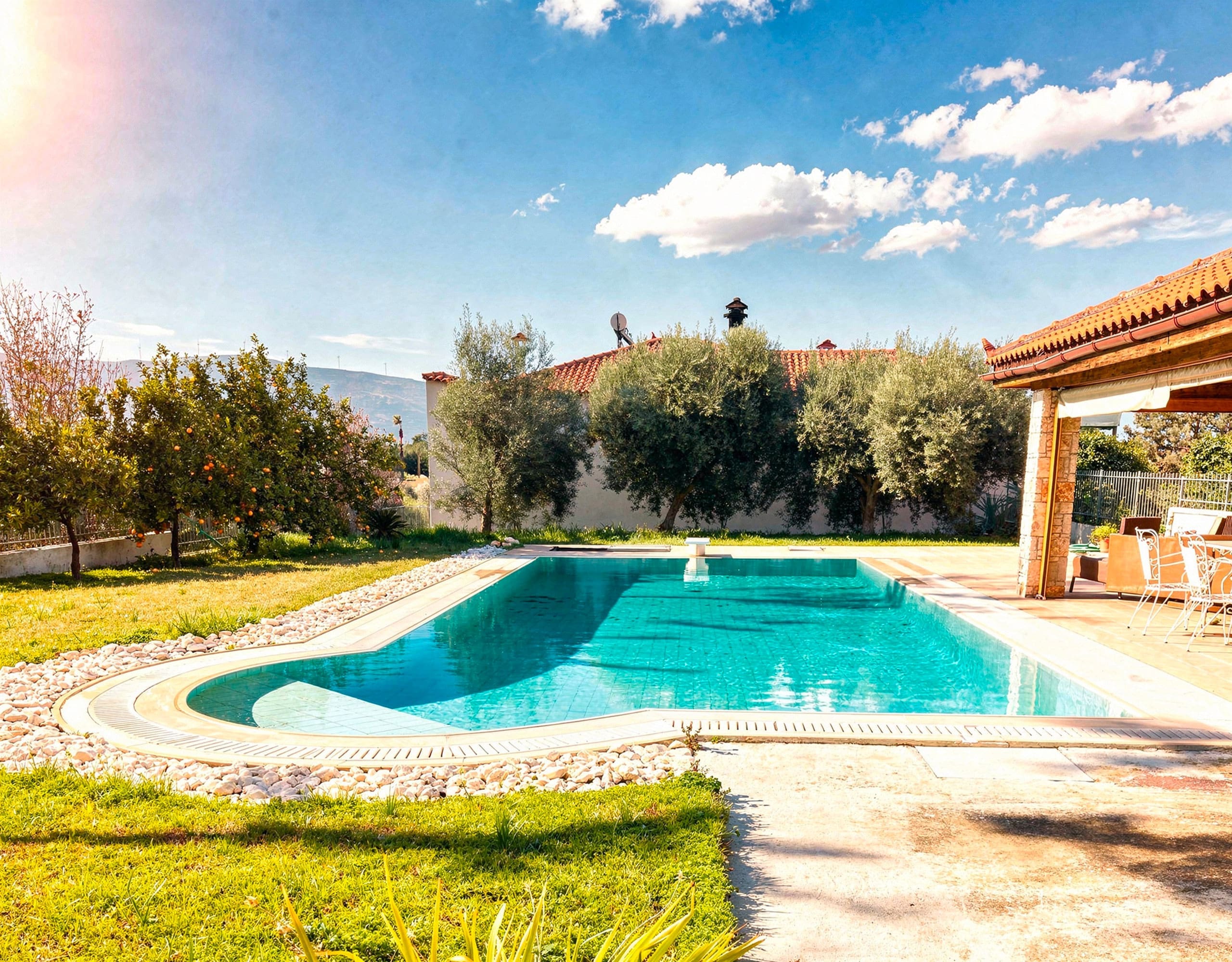 Wide view of the private swimming pool at the detached maisonette in Eretria, Evia