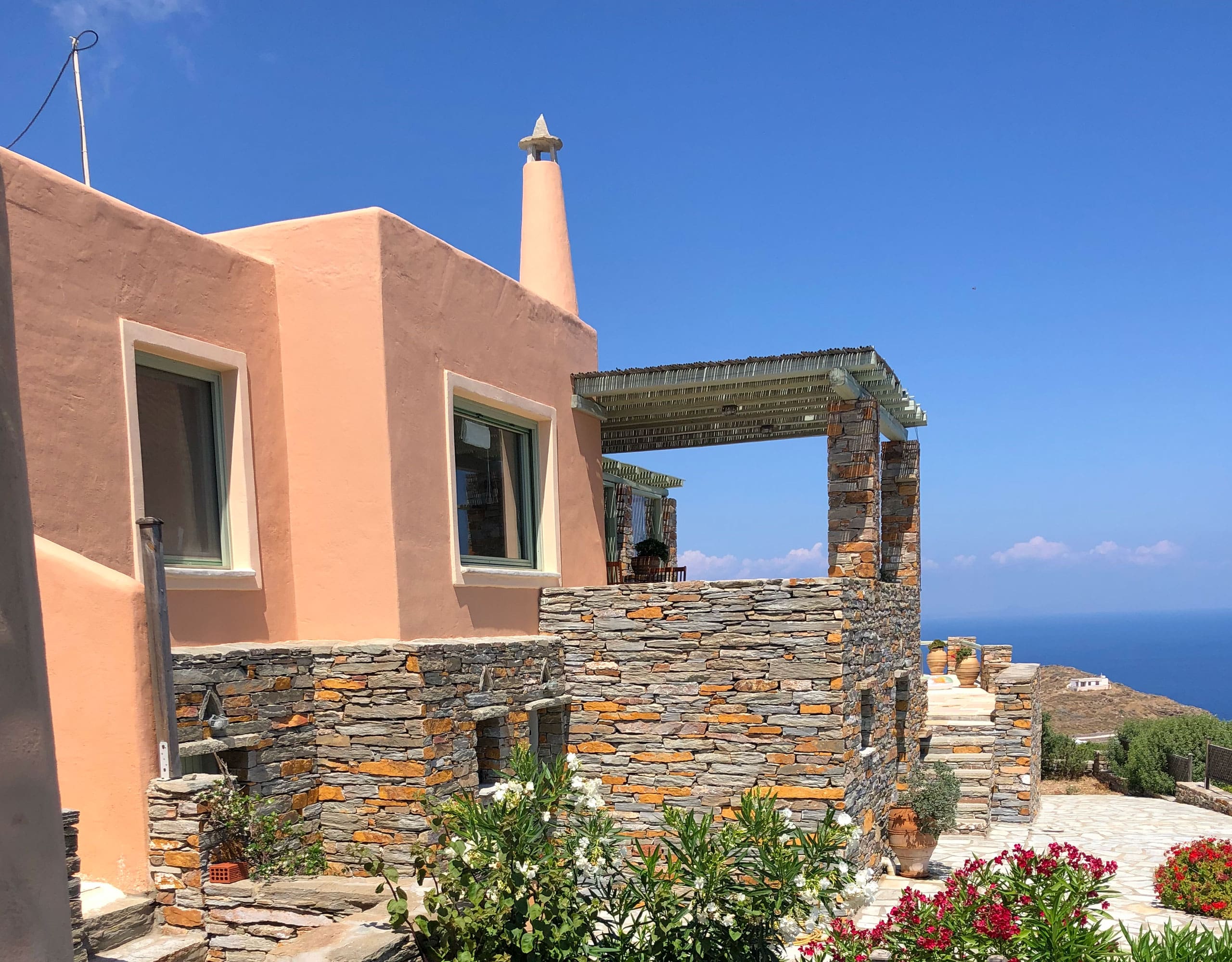 Front exterior of the stone-clad maisonette in Kea (Tzia), Greece