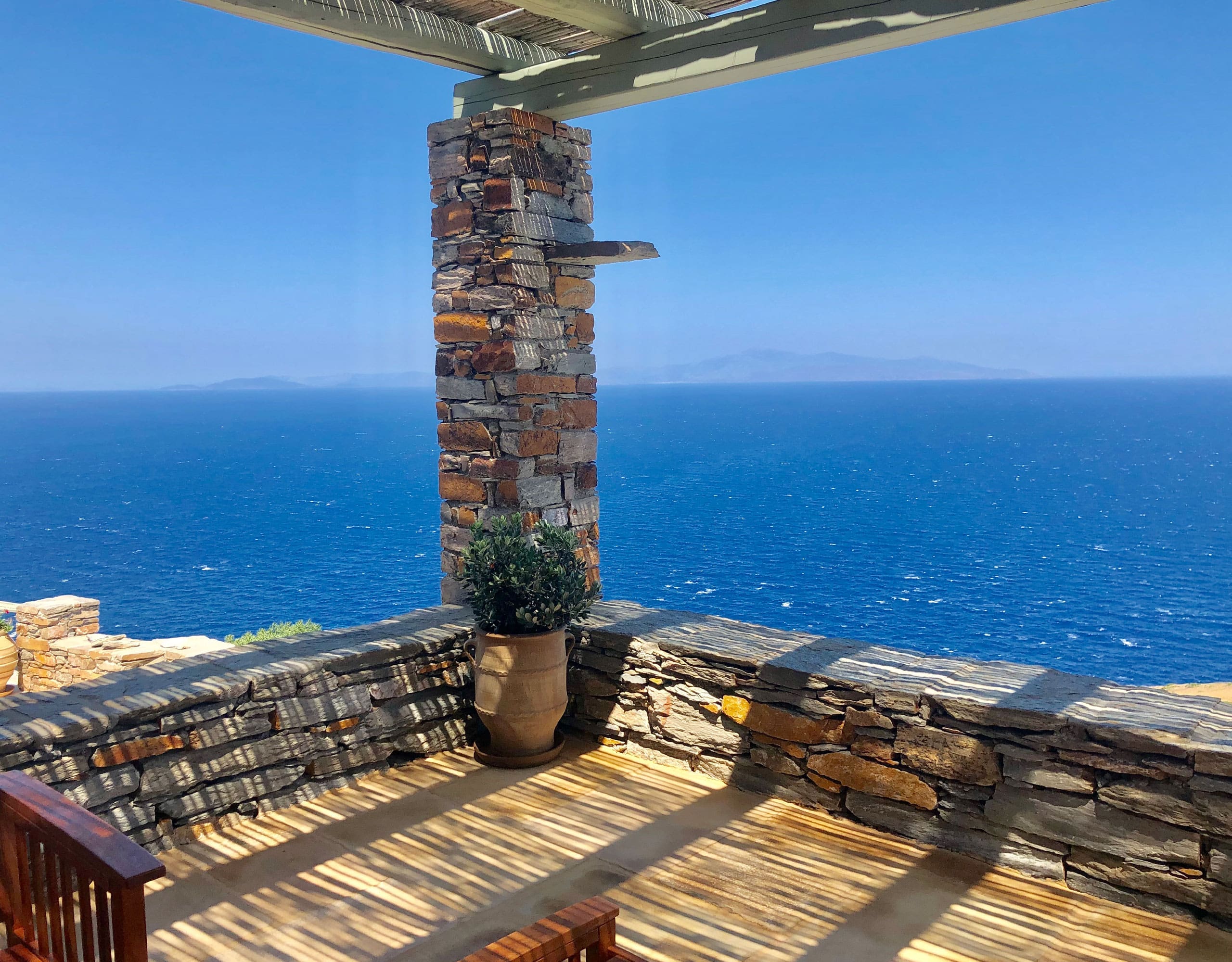 Open terrace with stone pillar and Aegean view in Kea (Tzia)